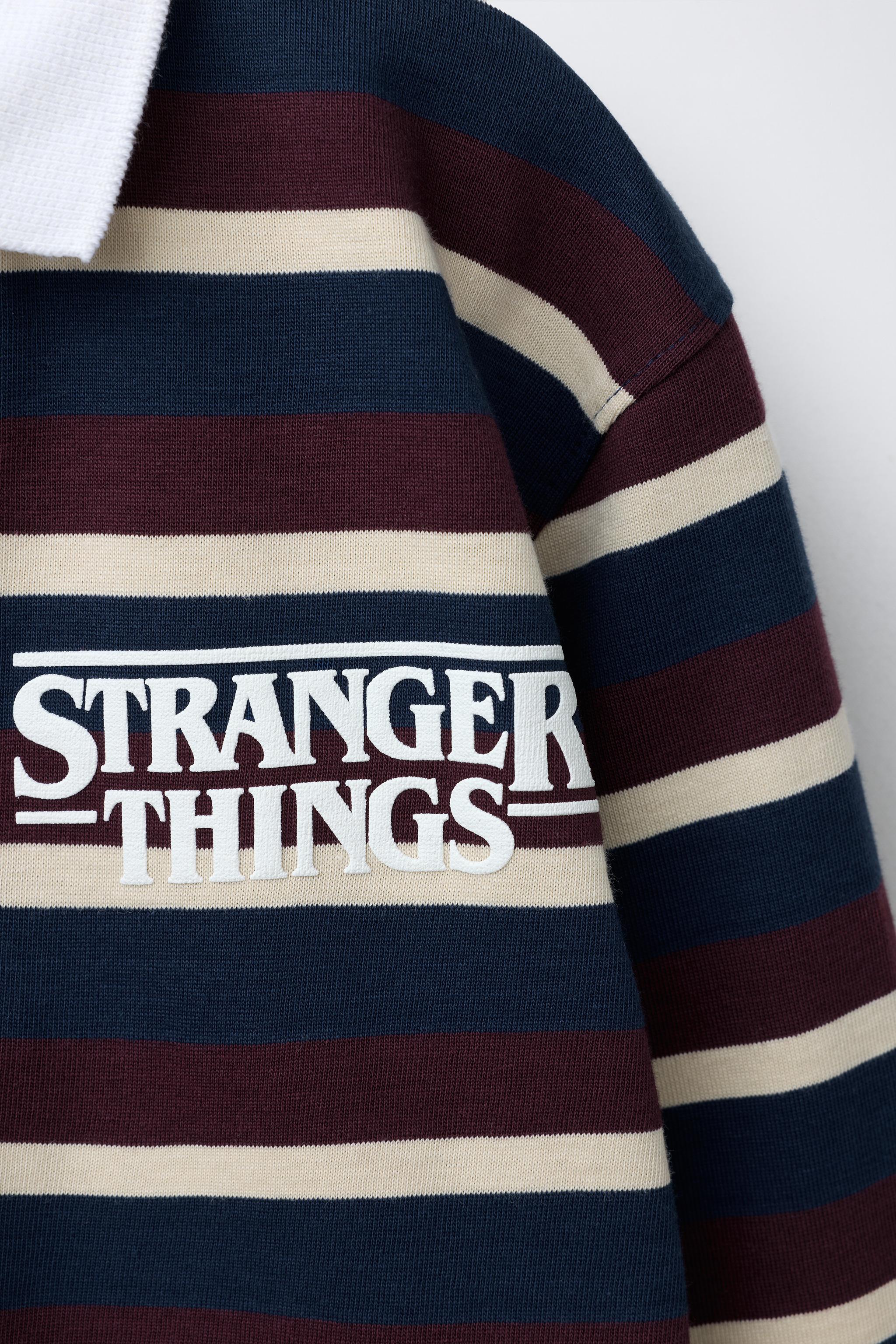 STRIPED STRANGER THINGS © NETFLIX POLO SHIRT